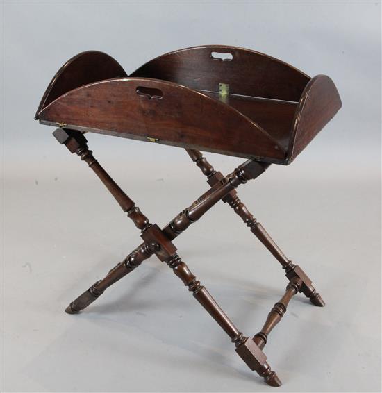 A George III mahogany butlers tray and folding stand, tray 3ft 6in. x 2ft 8in.